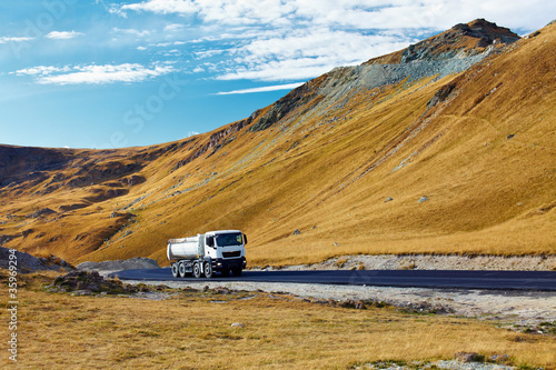 Photo: Lorry on a road through mountains Lorry on a road through mountains