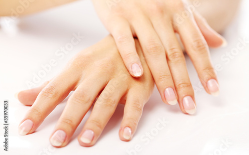 Photo: Beautiful hands with french manicure Beautiful hands with french manicure