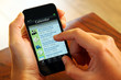 Foto: Businessfaru mit Smartphone Kalender Businessfaru mit Smartphone Kalender