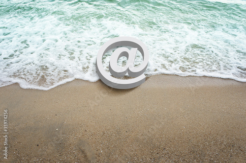 Photo: icons symbol 3d on beach . icons symbol 3d on beach .