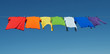 Rainbow laundry, bright shirts on a clothesline Rainbow laundry, bright shirts on a clothesline