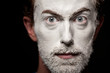 A man with makeup on his face