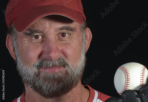 Photo: A Baseball Fan Holds Up a Caught Ball A Baseball Fan Holds Up a Caught Ball