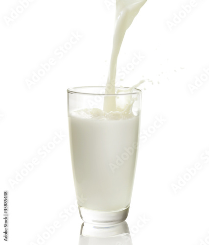 Photo: pouring a glass of milk pouring a glass of milk