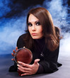 Young woman with crystal ball.