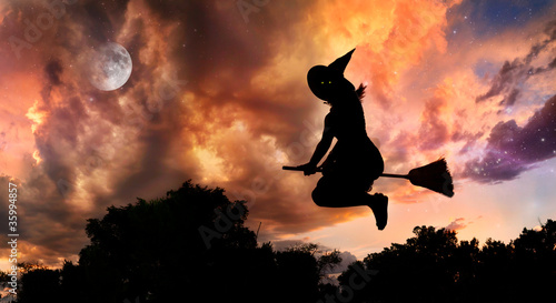 Photo: Flying witch on broomstick Flying witch on broomstick