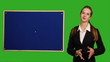 Video: Business woman showing something on green screen Business woman showing something on green screen