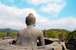Stone Buddha and Borobudur Temple Stone Buddha and Borobudur Temple