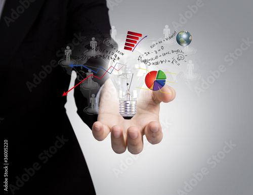 Photo: Business man holding light bulb in his hand Business man holding light bulb in his hand