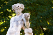 Naked young man sculpture in the park