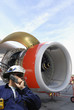 mechanic with jet engine and airplane mechanic with jet engine and airplane