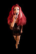 Drag Queen. Man dressed as Woman. On black.