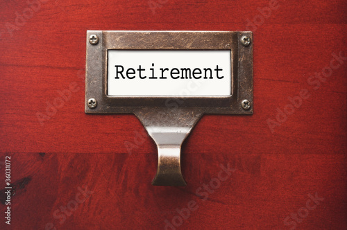 Photo: Lustrous Wooden Cabinet with Retirement File Label Lustrous Wooden Cabinet with Retirement File Label