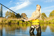 woman fishing in pond