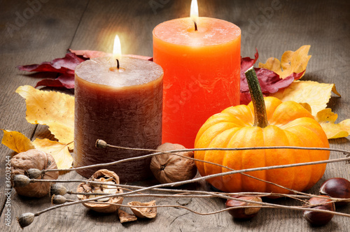Photo: Autumn setting with candles and pumpkin Autumn setting with candles and pumpkin