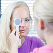 optometry concept - pretty, young female patient
