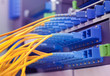 network cables and servers in a technology data center .