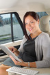 Executive businesswoman in car work touch tablet