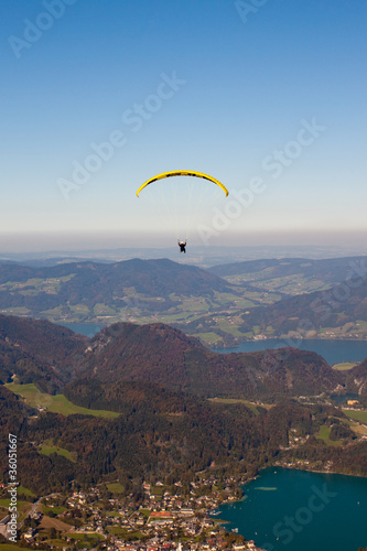 Photo: paragliding over lake and mountains in austrian Alps paragliding over lake and mountains in austrian Alps