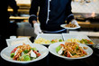 Plates of colorful salad ready to serve