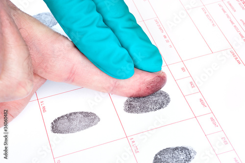 Photo: Man being finger printed Man being finger printed