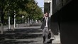 Video: Young man speaking with telephone and walking in the city Young man speaking with telephone and walking in the city
