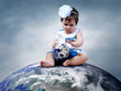 Photo: Child sitting on the Planet Earth with globes in hands Child sitting on the Planet Earth with globes in hands