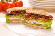 Two sandwich on wrapping paper