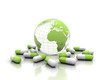 Medicine pills and world globe isolated on white