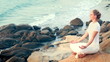 The young woman is practising the yoga. holiday relaxation.