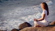 The young woman is practising the yoga. holiday relaxation.
