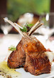 Raw rack of lamb fried with herbs and spices