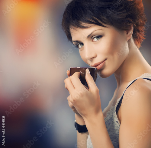 Photo: Beautiful Girl With Cup of Coffee Beautiful Girl With Cup of Coffee
