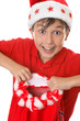 Excited boy holding a red Christmas sack