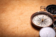 Compasses isolated on old paper Compasses isolated on old paper