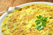 Italian omelette with parsley and parmesan cheese, closeup