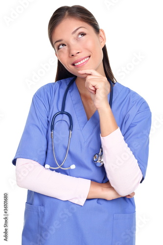 Photo: Thinking nurse isolated Thinking nurse isolated
