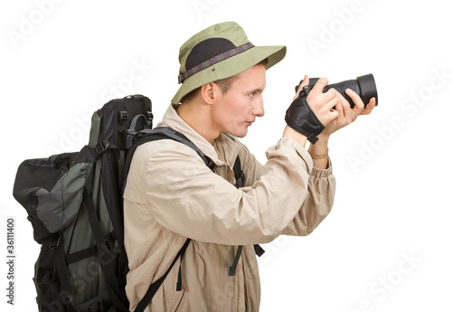 Photo: young man dressed in a tourist young man dressed in a tourist