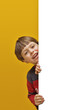 smiling litte boy holding white board
