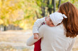 Sleeping little girl on mother's shoulder