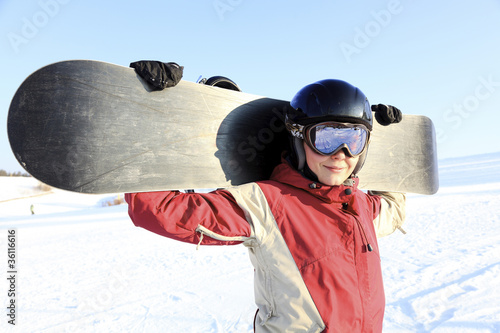 Photo: Female snowboarder on the snowhill. Female snowboarder on the snowhill.