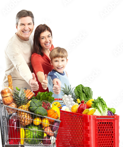 Foto : Happy family with a shopping cart. Happy family with a shopping cart.
