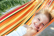 Foto: child relaxing in a hammock child relaxing in a hammock