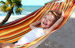 child relaxing in a hammock child relaxing in a hammock