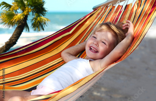 Photo: child relaxing in a hammock child relaxing in a hammock