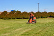 Mature man driving grass cutter
