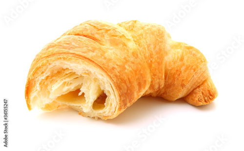 Photo: Image of fractured croissant isolated on white Image of fractured croissant isolated on white