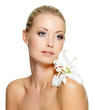Beauty woman with perfect clean skin and flower