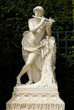 white marble statue emplaced in Versailles garden
