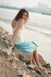 woman sitting on stone woman sitting on stone